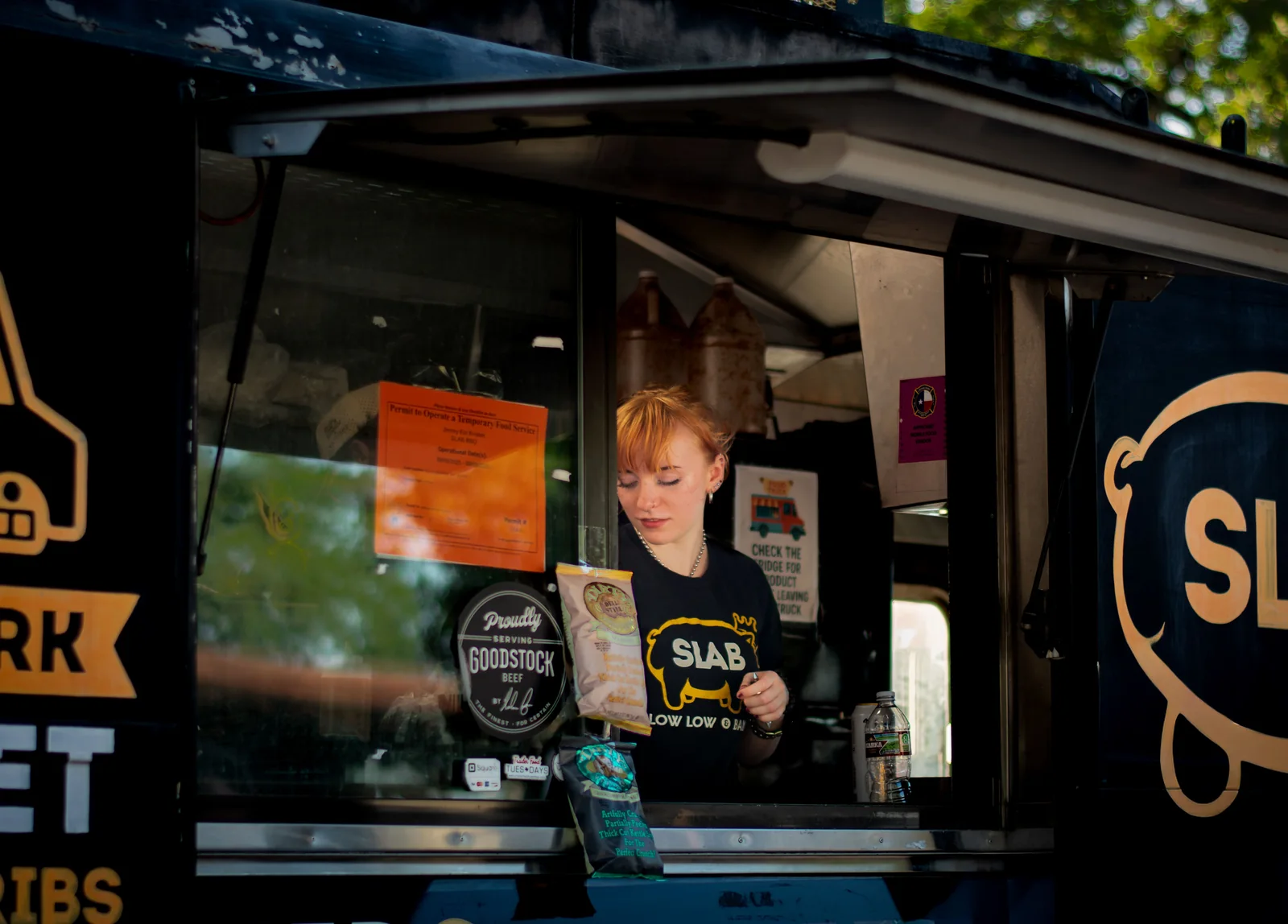 A food truck vendor serving customers in Austin